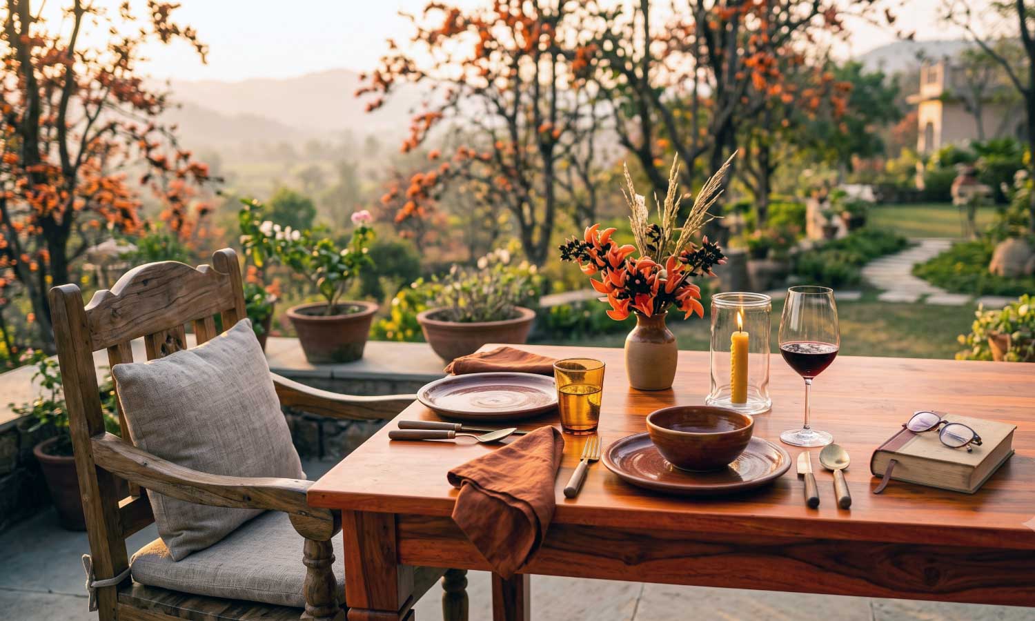 A single table set for one guest at Palaash restaurant at Tipai during golden hour