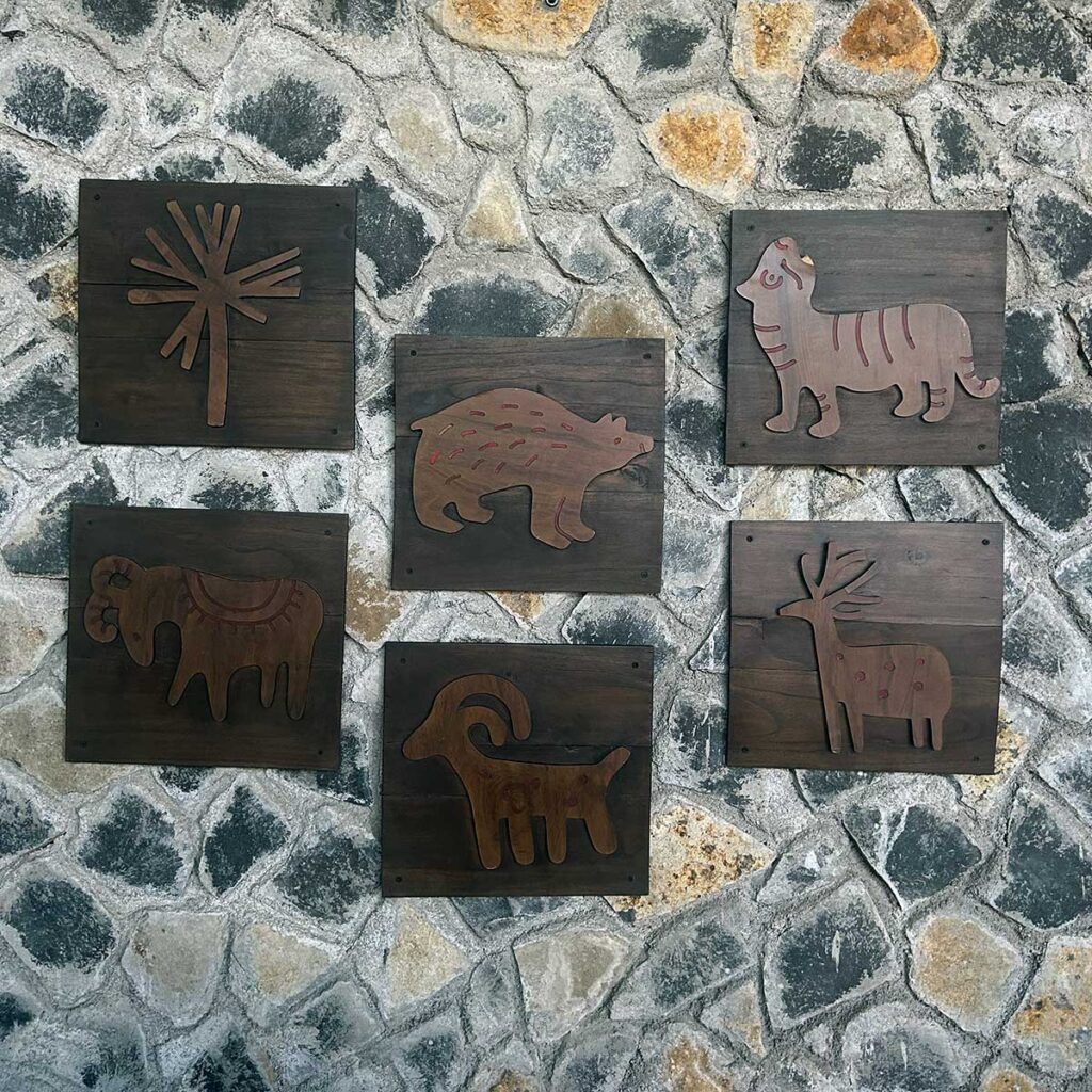 wooden animal wall frame in jungle resort interior